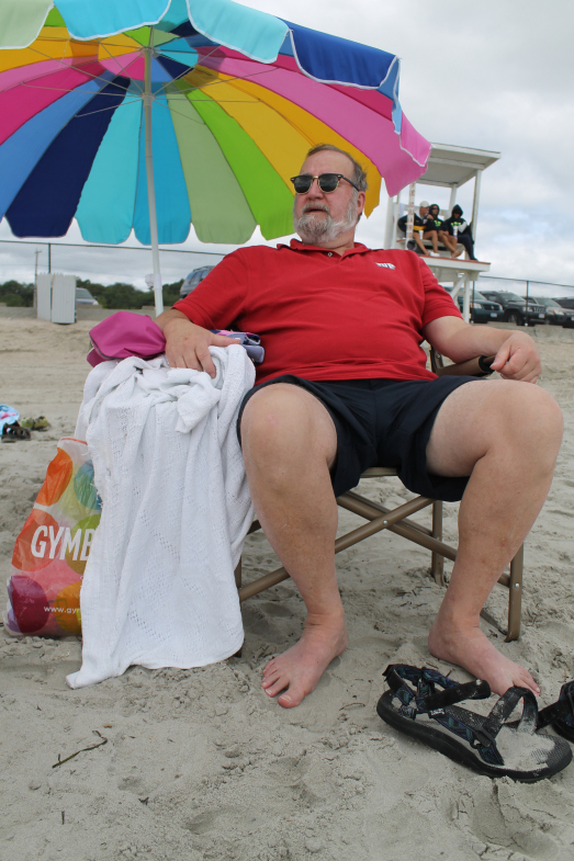 My dad enjoying some time at the beach.